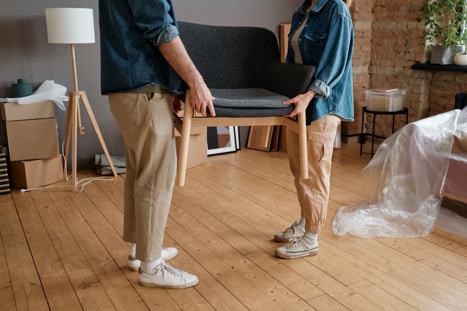 couple carrying furniture
